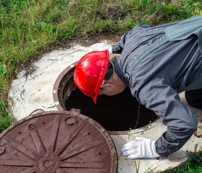 A,Male,Plumber,Opened,The,Hatch,Of,A,Water,Well